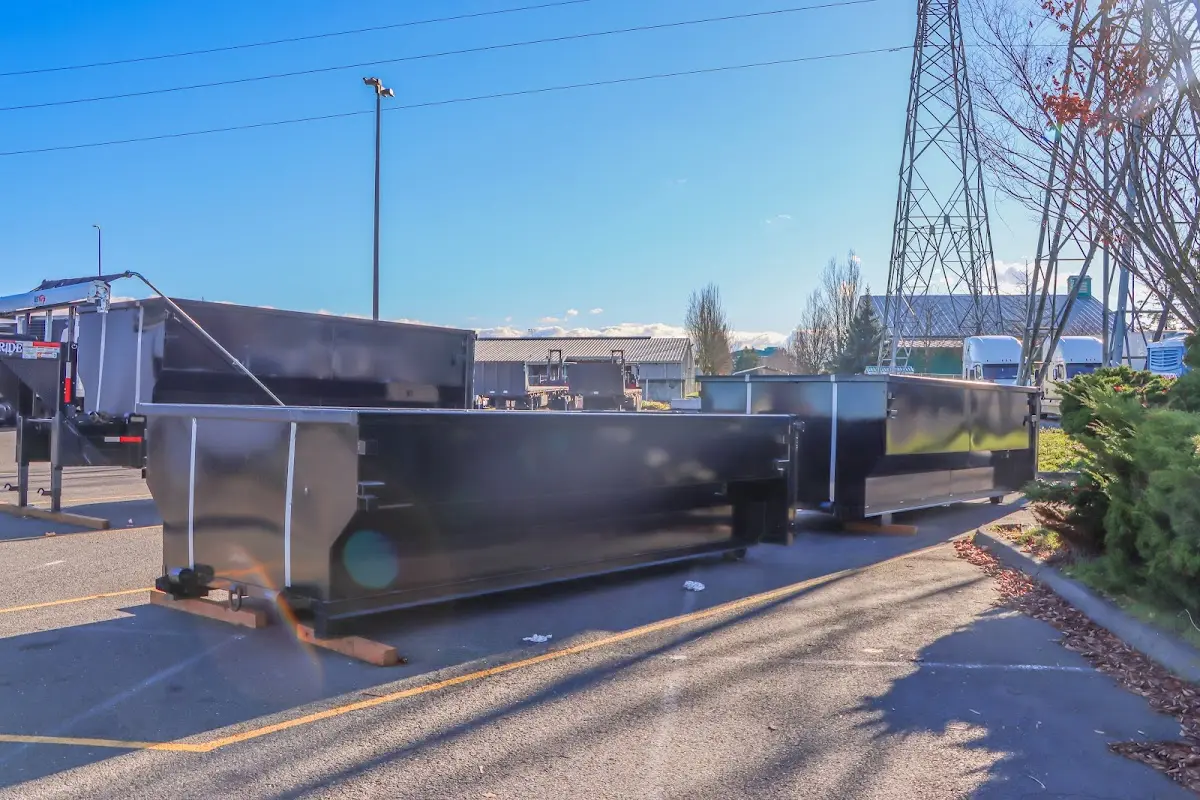 Roll-off dumpster ready for waste disposal at job site for Demolition Dumpster Rental in Oskaloosa